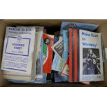 A box of Manchester City football programmes, 1970's tickets, etc., some signed