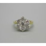 An 18ct gold, seven stone diamond cluster ring, stamped 2ct to the band, 5.1g, P