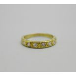 An 18ct gold, nine stone diamond half eternity ring, 0.25ct diamond weight, 2.5g, L