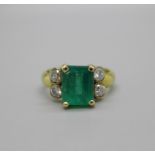 An 18ct gold, emerald and diamond ring, emerald approximately 3.8ct weight, diamonds approximately