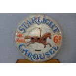 A painted wooden Starlight Carousel fairground sign