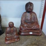 Two painted concrete figure of a seated Buddhas