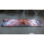 A painted wooden House of Horrors fairground sign