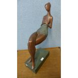 A Surrealist bronze figure of a seated lady