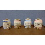 A set of four Wade porcelain spirit flasks