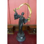 A large French Art Nouveau style bronze figure of a lady, on black marble socle