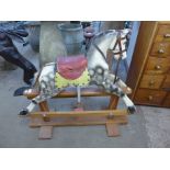 A vintage Leeway painted dapple grey rocking horse