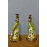 A pair of French style painted porcelain and gilt metal mounted parrot candlesticks