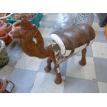 An African carved softwood camel stool