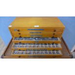 A vintage beech six drawer printers cabinet, containing printers type