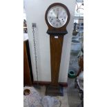 An Art Deco walnut dwarf longcase clock