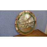 An Art Deco circular peach and green glass framed convex mirror