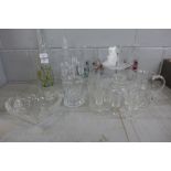 A collection of glassware including three decanters, four floral vases and a large dish, etc. **