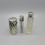 A silver scent bottle by Sampson Mordan dated London 1887, and two small silver topped glass