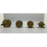 A vintage brass Allcock fly fishing reel and three others