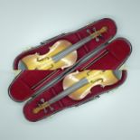 A miniature model of a violin and case, 23cm