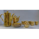 A Royal Worcester coffee pot and a Wade six setting coffee set, one cup a/f