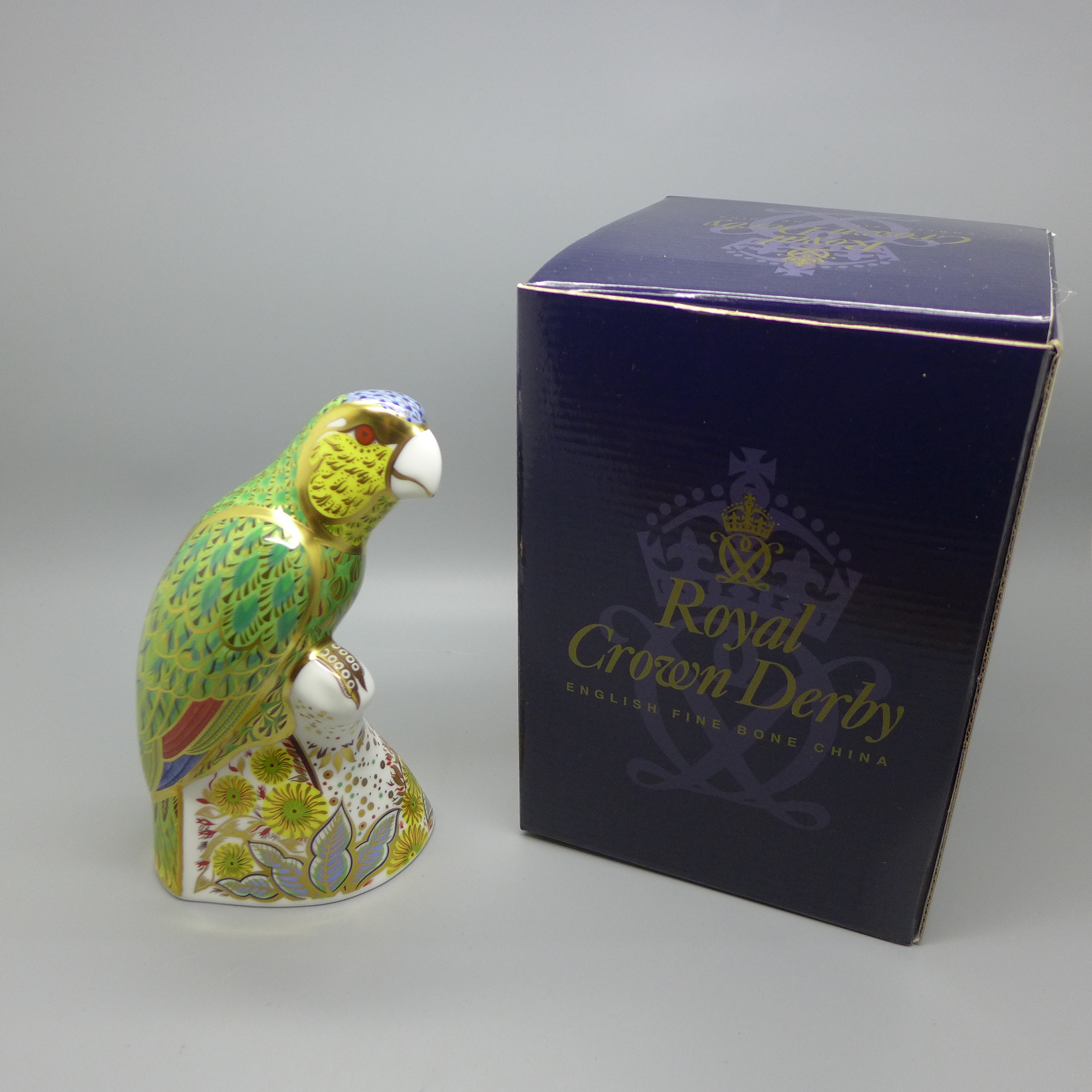 A Royal Crown Derby Bird Paperweight - Amazon Green Parrot, limited edition of 2500, number 442,