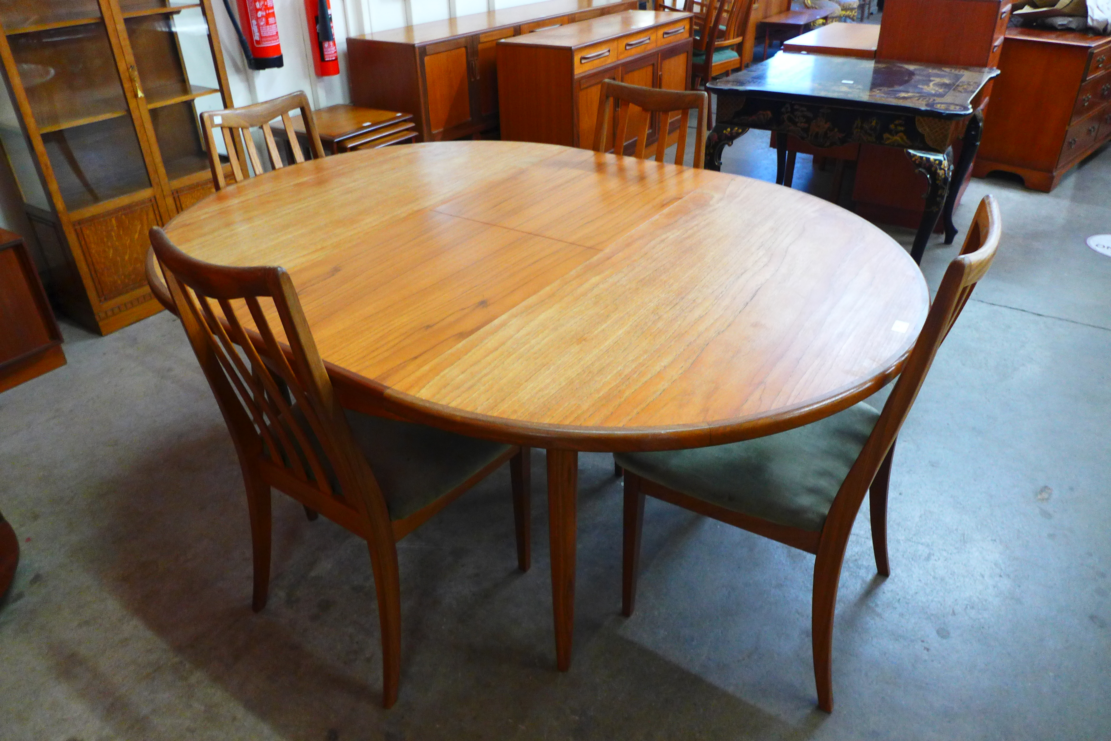 A G-Plan Fresco teak extending dining table and four chairs