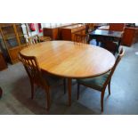 A G-Plan Fresco teak extending dining table and four chairs