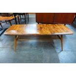 An Ercol elm and beech 459 model Windsor coffee table