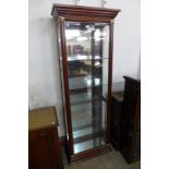 A mahogany display cabinet