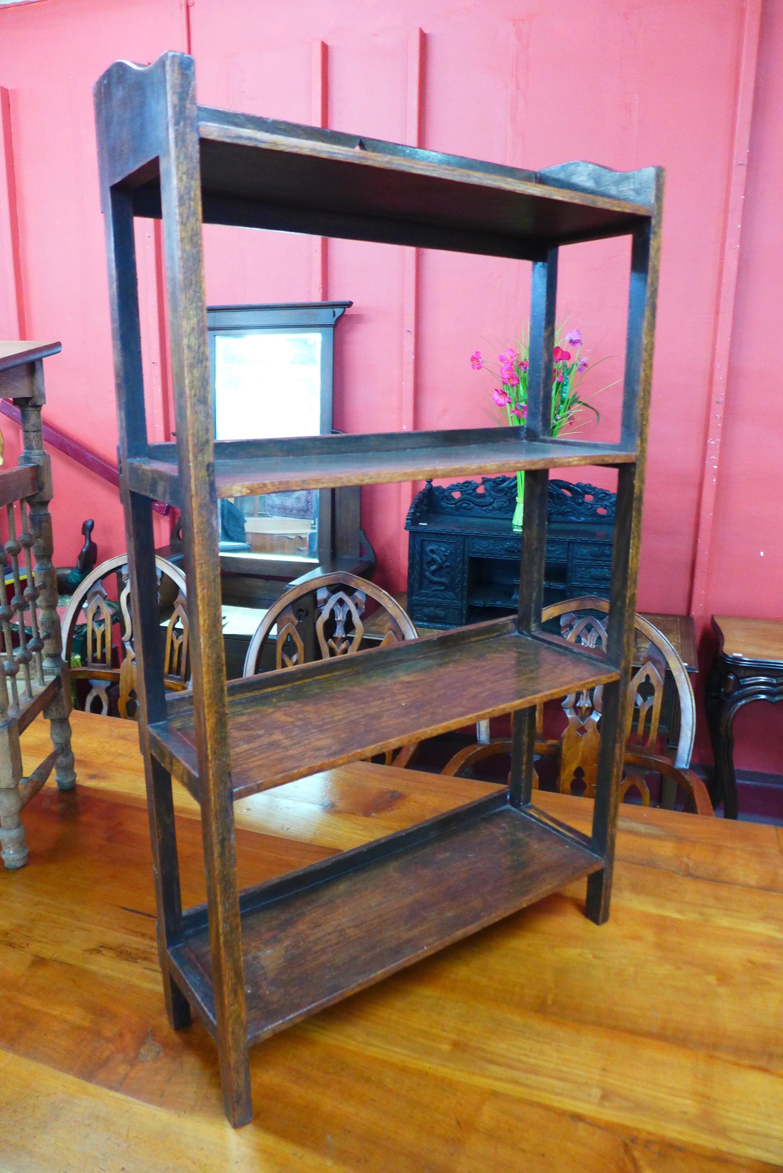 An Arts and Crafts oak open bookcase