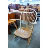 An Ercol Blonde elm and beech 315 model Grandfather rocking chair