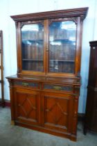 A Victorian Aesthetic Movement carved oak bookcase