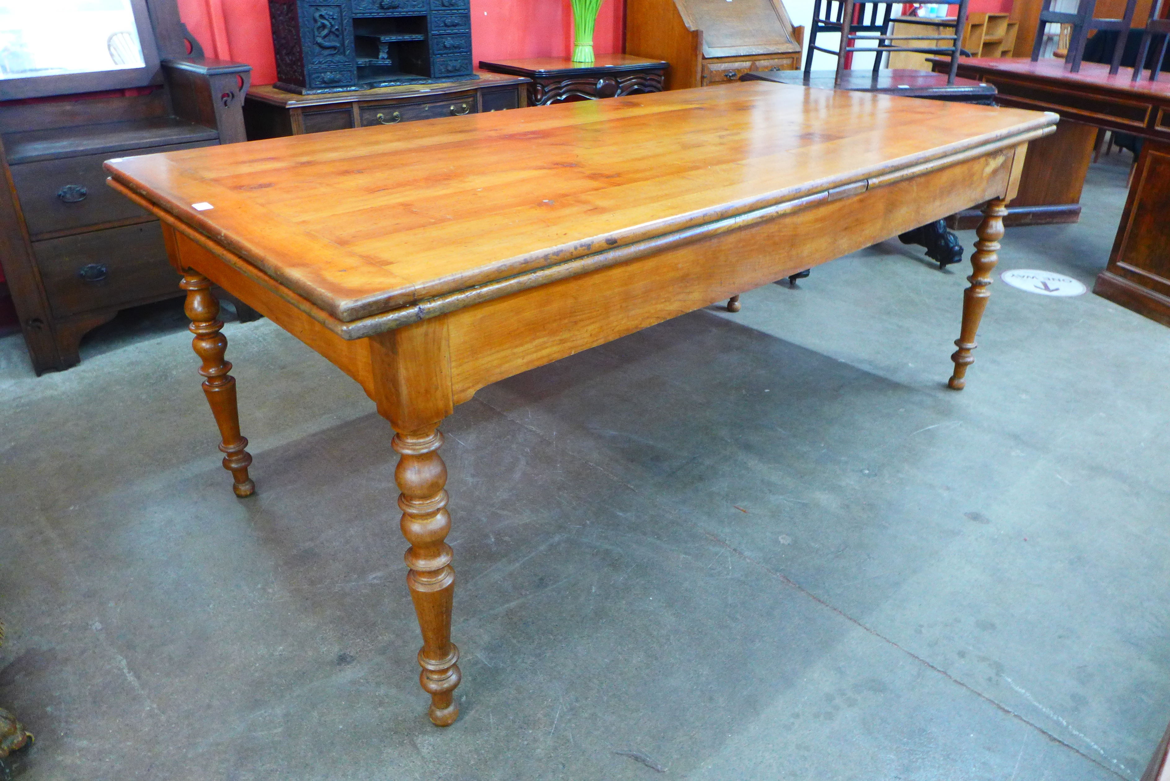 A 19th Century French cherrywood extending farmhouse table