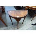 A mahogany demi-lune hall table