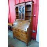 An Arts and Crafts oak bureau bookcase, attributed to Liberty & Co.