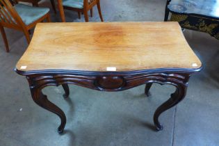 A 19th Century French rosewood serpentine concertina action fold over tea table