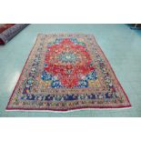 A hand knotted Persian Tabriz rug, 295 x 195cms