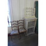 A French painted single door cupboard, painted wooden rack and a pair of beech chairs