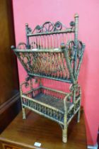 An Arts and Crafts wicker newspaper stand