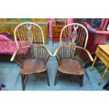 A pair of Victorian elm and beech Windsor highback armchairs