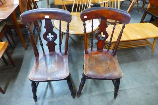A pair of Victorian Gothic Revival mahogany kitchen chairs