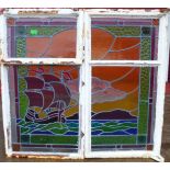 A pair of Art Deco stained glass windows, depicting a galleon at sea