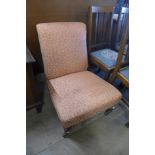 A Victorian Howard style mahogany and upholstered nursing chair