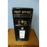 A black painted Post Office letter box, with key