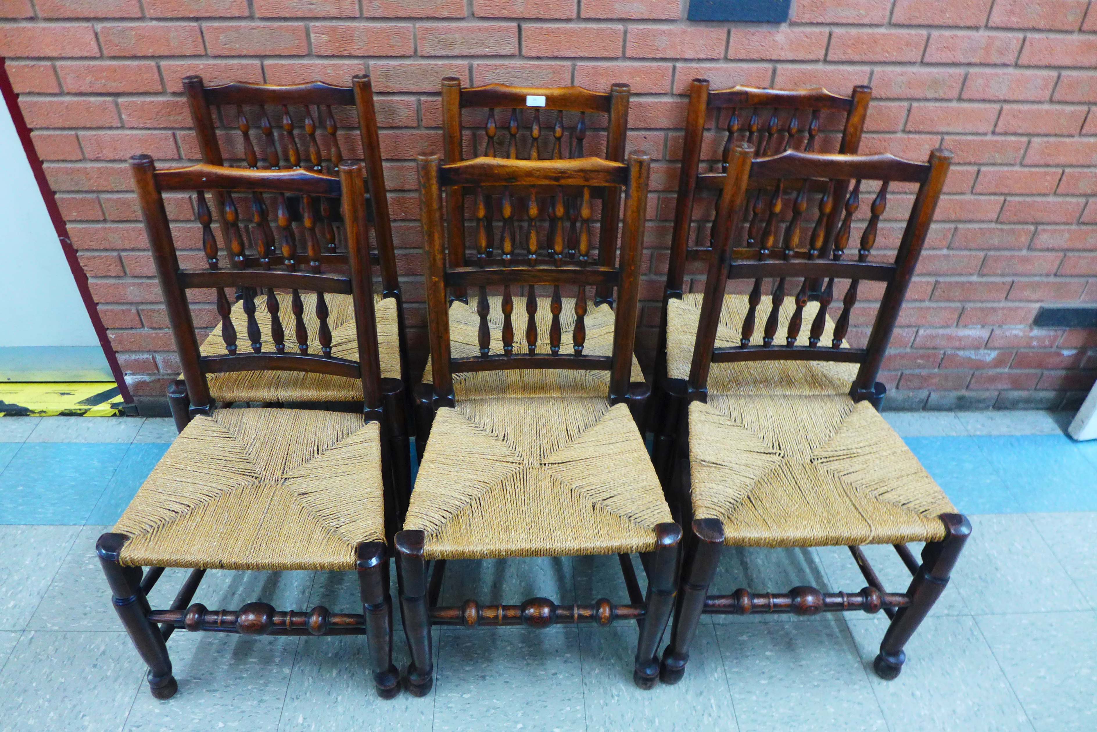 A set of six Georg III style elm and ash spindle back rush seated chairs - Image 2 of 4