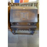 A carved oak bureau