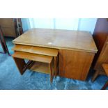 A McIntosh Tristor teak fold over cabinet/table