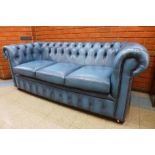 A blue leather Chesterfield settee