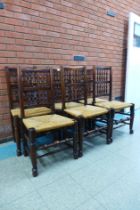 A set of six Georg III style elm and ash spindle back rush seated chairs