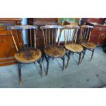 A set of four Victorian elm and beech penny seat kitchen chairs