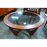 A G-Plan Astro teak and glass topped circular coffee table