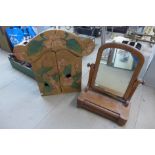 A Victorian walnut toilet mirror, a/f and a hardwood folk art wall hanging cabinet