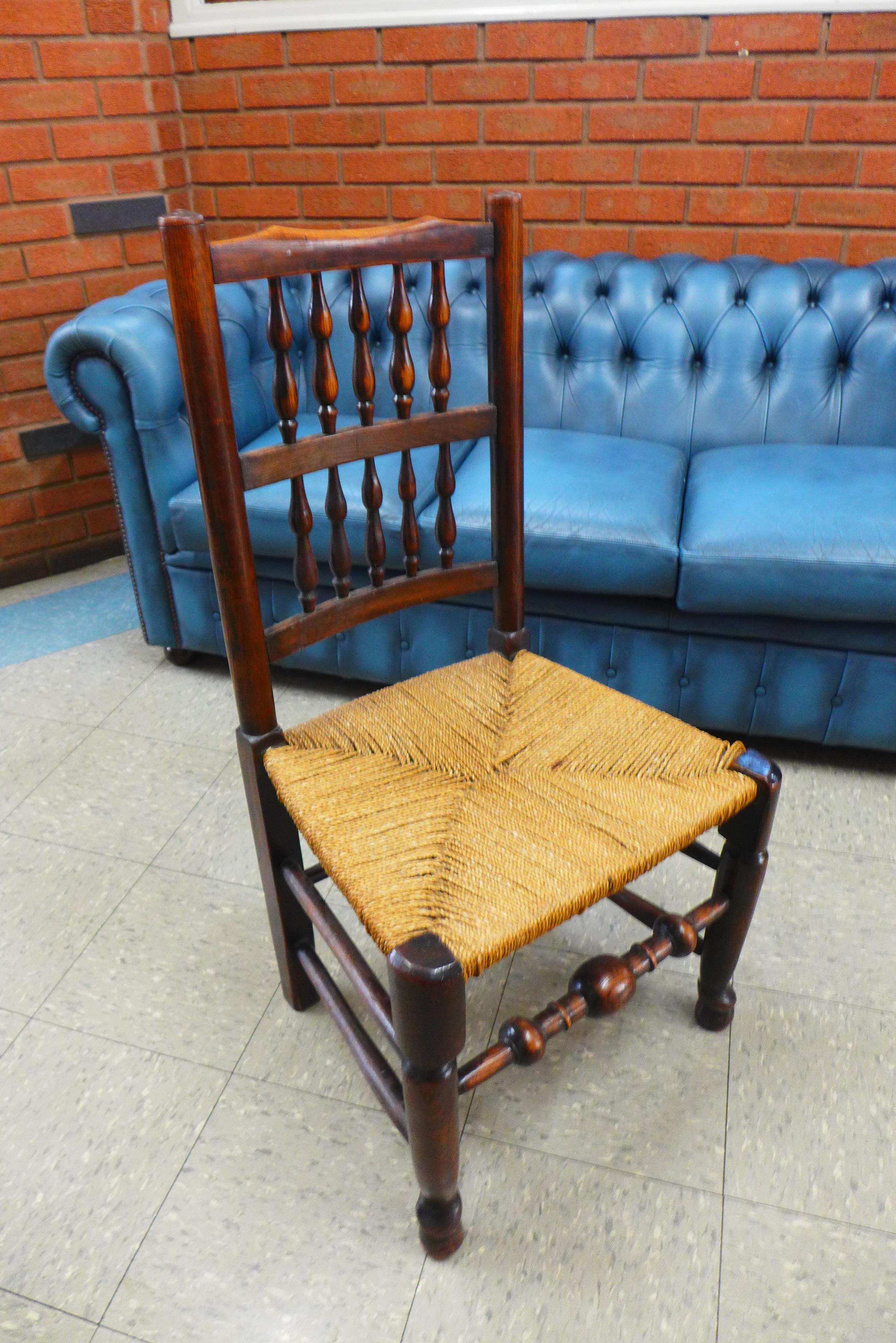 A set of six Georg III style elm and ash spindle back rush seated chairs - Image 4 of 4